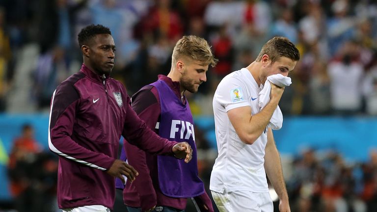 Danny Welbeck, Luke Shaw and Jordan Henderson (left to right) are left dejected after the final whistle in England's World Cup 2014 defeat to Uruguay