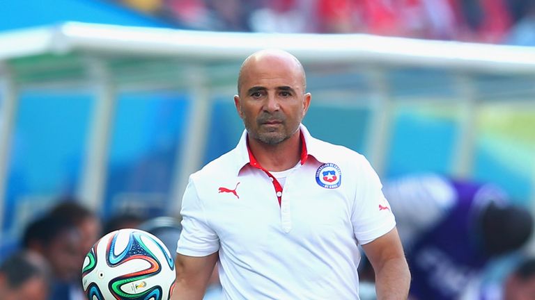 Head coach Jorge Sampaoli of Chile holds the match ball during the 2014 FIFA World Cup Brazil Group B match between the Nethe