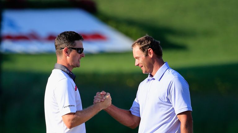 Justin Rose of England shakes hands with Shawn Stefani of the United States after their play-off at the Quickens Loans National at Congressional