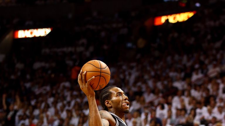 Kawhi Leonard #2 of the San Antonio Spurs drives to the basket against the Miami Heat during Game Three of the 2014 NBA Finals 