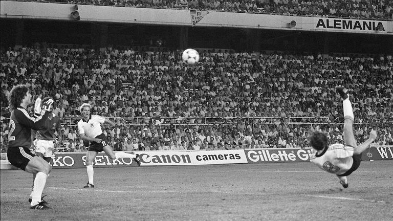 West Germany's Klaus Fischer ties the score at 3-3 on a reverse bicycle kick past France goalkeeper Jean-Luc Ettori during the 1982 World Cup semi-final