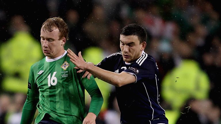 DUBLIN, IRELAND - FEBRUARY 09: Liam Boyce of Northern Ireland (L) in action with Robert Snodgrass of Scoltand during the Carling Nations Cup match between 