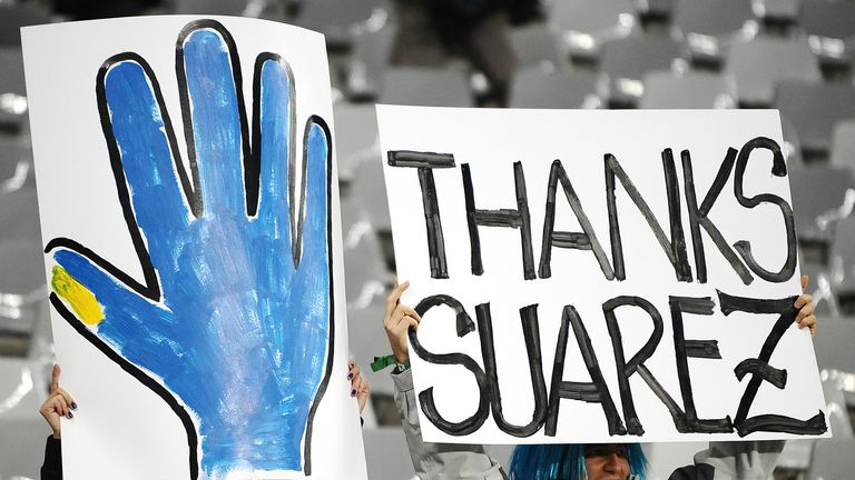 Uruguayan fans support striker Luis Suarez during the 2010 World Cup semi-final football match between Uruguay and Netherlands in 2010