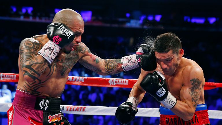Miguel Cotto of Puerto Rico lands a left to the head of Sergio Martinez of Argentina at Madison Square Garden, New York