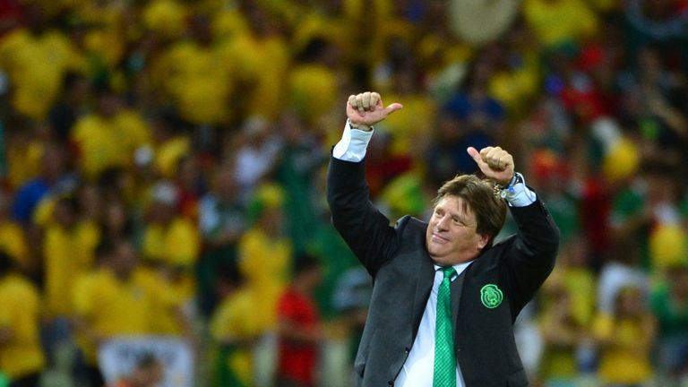 Mexico's coach Miguel Herrera reacts after a Group A football match between Brazil and Mexico in the Castelao Stadium in Fortaleza during the 2014 