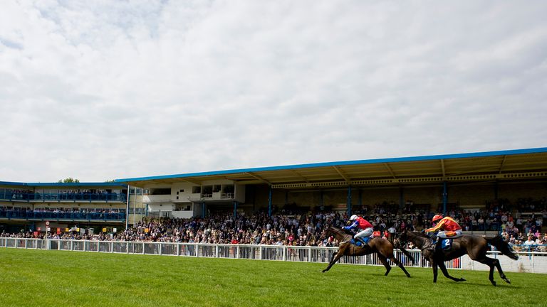 NEWTON ABBOT, ENGLAND - SEPTEMBER 01: Donal Fahy riding Dark Spirit (L) win The Green Taveners Juvenile Maiden Hurdle Race at Newton Abbot racecourse on Se