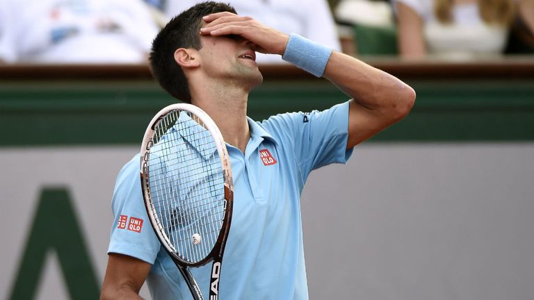 Serbia's Novak Djokovic reacts after a point against Spain's Rafael Nadal during the French tennis Open men's final match at the Roland Garros