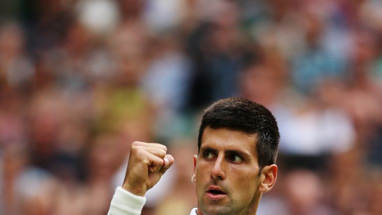 Novak Djokovic celebrates after his first round match at Wimbledon 2014