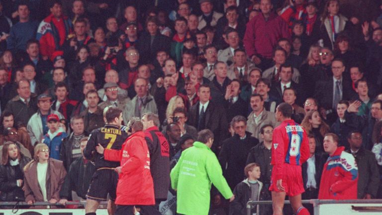 25 JAN 1995:  ERIC CANTONA OF MANCHESTER UNITED IS LED OFF THE PITCH AFTER FIGHTING WITH A FAN AFTER BEING SENT OFF DURING THE CRYSTAL PALACE V MANCHESTER 