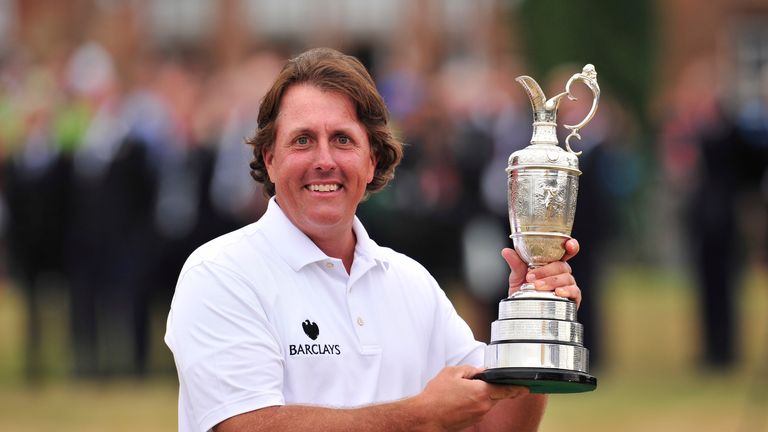 Phil Mickelson holds the Claret Jug after winning the 2013 British Open Golf Championship at Muirfield golf course at Gullane in Scotland on July