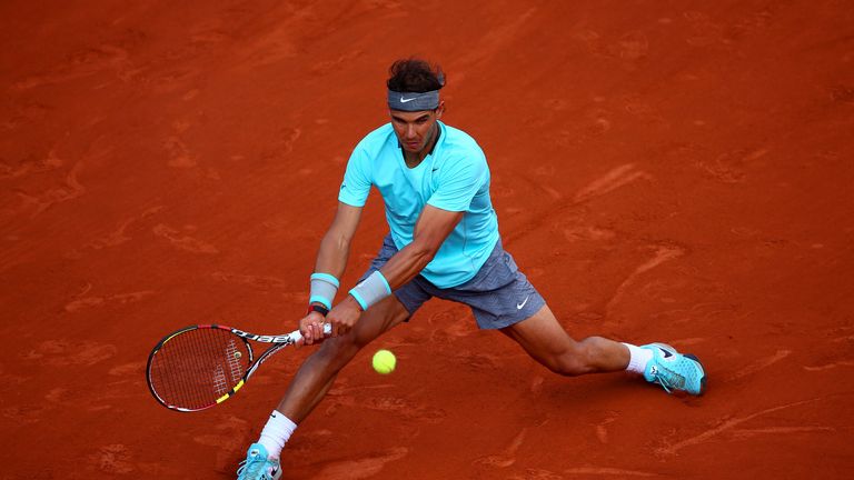 Rafael Nadal returns a shot during his men's singles quarter-final at the French Open