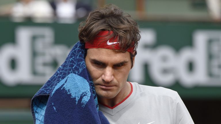 Switzerland's Roger Federer gestures during his defeat to Latvia's Ernests Gulbis at the 2014 French Open