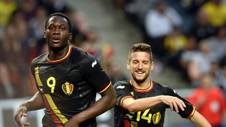 Belgium's forward Romelo Lukaku (L) celebrates with Belgium's midfielder Dries Mertens after scoring a goal 