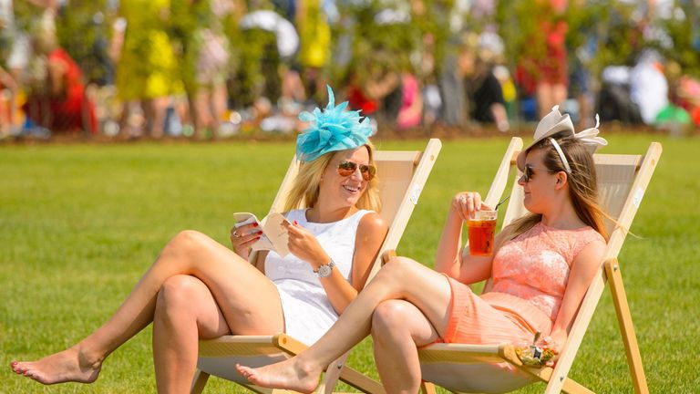 Two racegoers enjoy the hot weather during at Royal Ascot