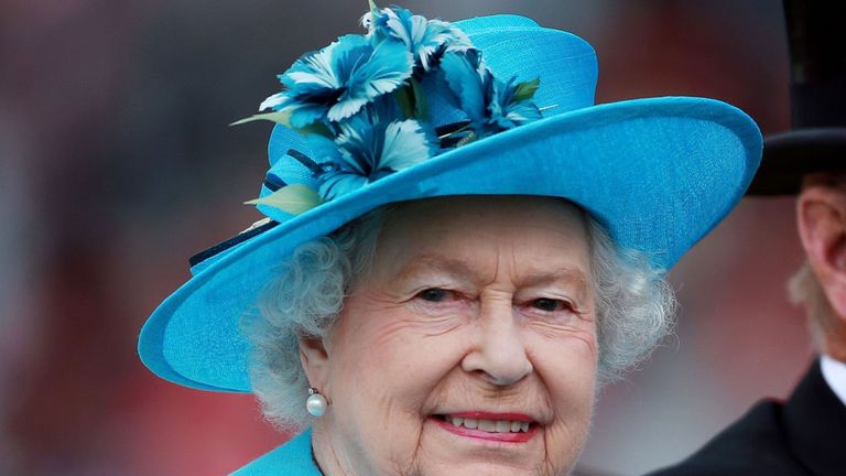 The queen arrives just in time for the opening race