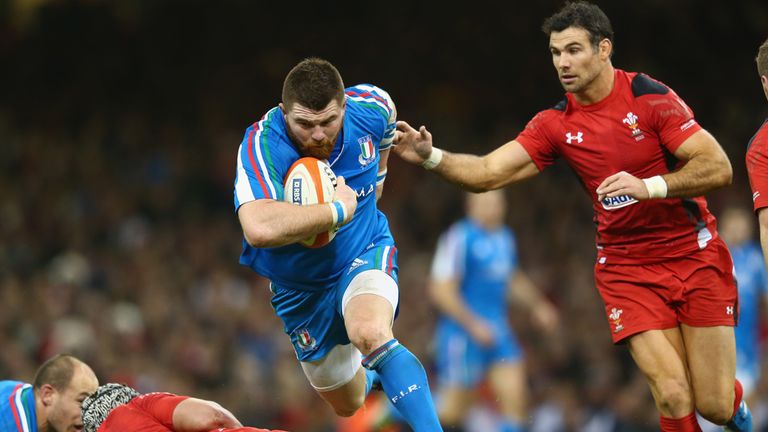CARDIFF, WALES - FEBRUARY 01:  Michele Rizzo (C)  of Italy surges past Mike Phillips (R) of Wales during the RBS Six Nations match between Wales and Italy 