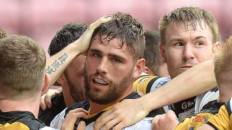 Castleford Tigers' Lee Jewitt (centre) celebrates his try against Wigan Warriors with team mates during the Tetley's Challenge Cup Quarter Final match at t