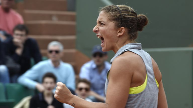 Italy's Sara Errani celebrates after winning a point against Serbia's Jelena Jankovic during their French Open clash