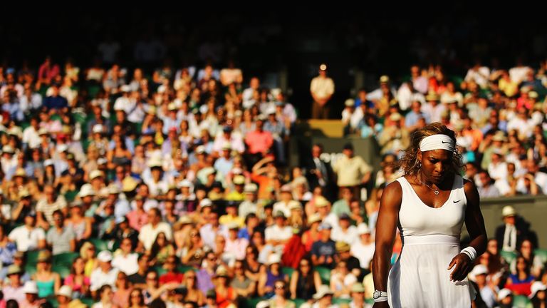 Serena Williams in action during her Ladies' Singles first round match at Wimbledon 2014