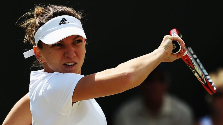 LONDON, ENGLAND - JUNE 27:  Simona Halep of Romania plays a forehand return during the Ladies' Singles second round match against Lesia Tsurenko of Ukraine