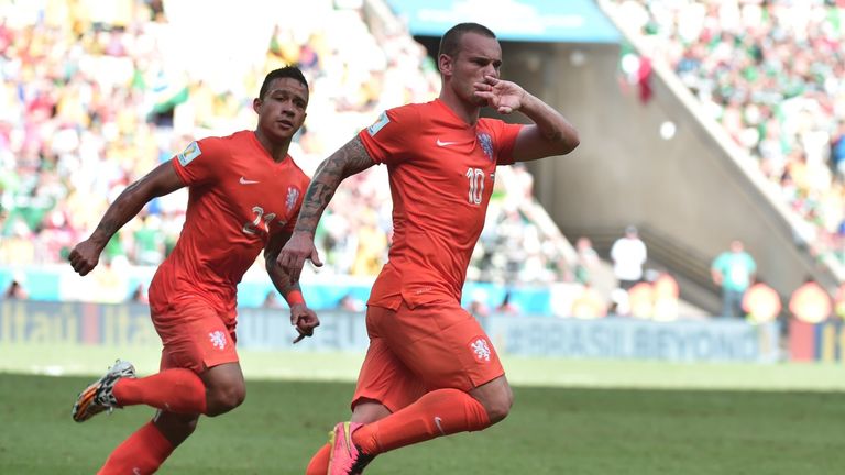 Wesley Sneijder celebrates with Netherlands forward Memphis Depay after scoring in the World Cup Round of 16 football match v Mexico