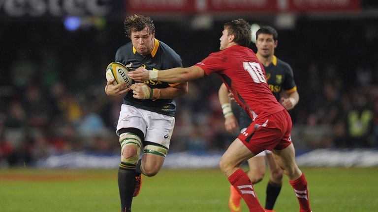 South Africa N.8 Duane Vermeulen (L) is tackled by Wales Flyhalf Dan Biggar (R) during the Rugby test match between South Africa and Wales at Kings Stadium