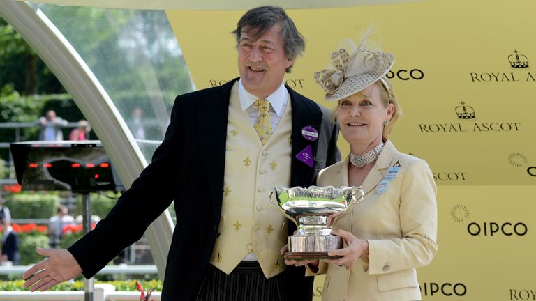 Stephen Fry (L) presents The Chesham Stakes award to horse owner Rachel D. S. Hood