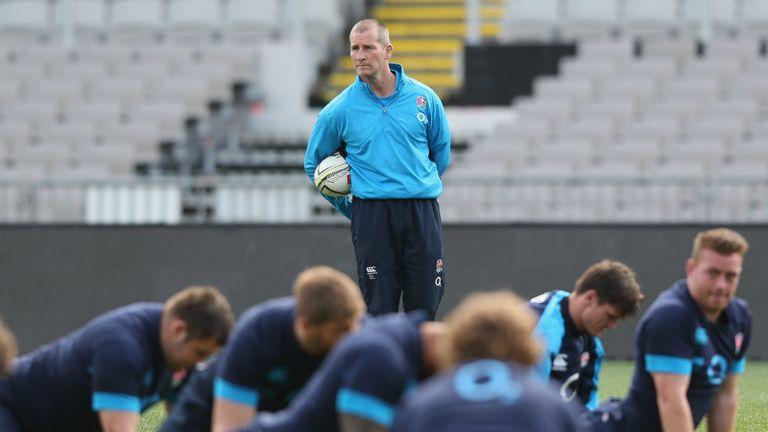 Head coach Stuart Lancaster watched on as England stretched off