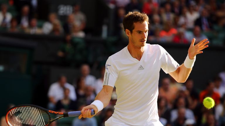  Andy Murray of Great Britain plays a forehand return during his Gentlemen's Singles third round match against Roberto Bautista Agut at Wimbledon 2014