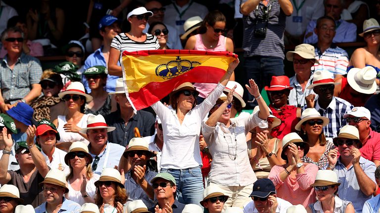 PARIS, FRANCE - JUNE 08:  Fans of Rafael Nadal of Spain show their support as they wave the Spanish national flag during his men's singles final match agai