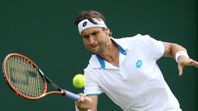 Spain's David Ferrer in action against Russia's Andrey Kuznetsov during day three of the Wimbledon Championships