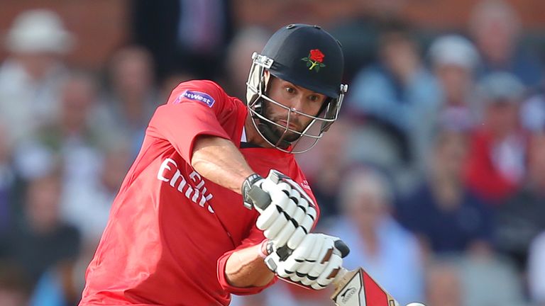 Tom Smith of Lancashire Lightning hits a six at Old Trafford