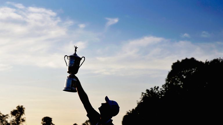 Justin Rose celebrates with the U.S. Open trophy after winning the 113th U.S. Open at Merion Golf Club in 2013