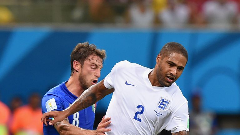 Glen Johnson of England holds off a challenge by Claudio Marchisio of Italy during the 2014 FIFA World Cup Brazil Group D match