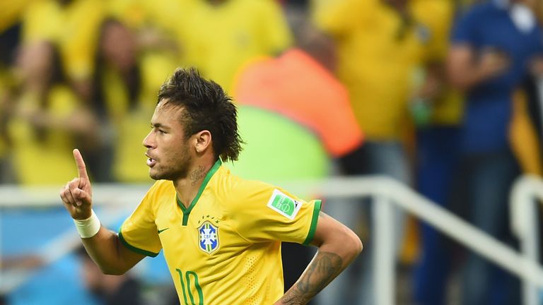 Neymar of Brazil celebrates after scoring a first half goal during the 2014 FIFA World Cup Brazil Group A match against Croatia