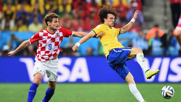 David Luiz of Brazil tries to control the ball against Nikica Jelavic of Croatia in the first half during the 2014 FIFA World Cup match
