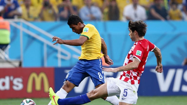 Vedran Corluka of Croatia challenges Paulinho of Brazil in the first half during the 2014 FIFA World Cup Group A match 