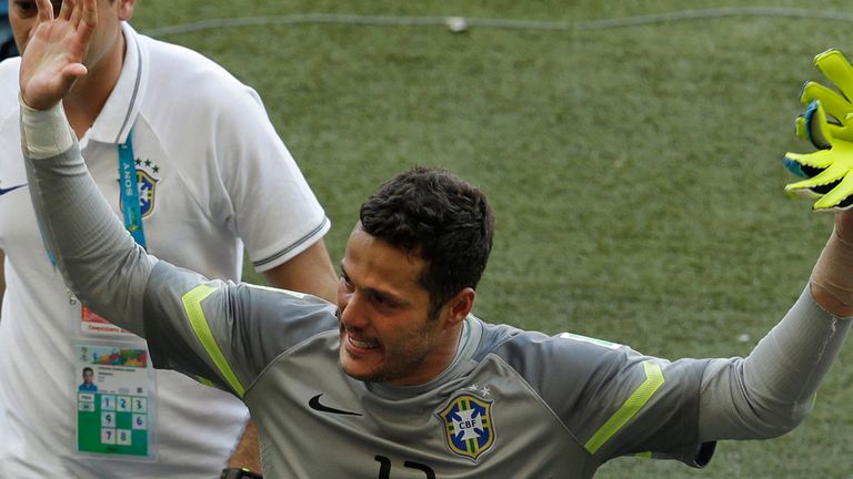Brazil's goalkeeper Julio Cesar leaves the pitch after the World Cup round of 16 soccer match between Brazil and Chile