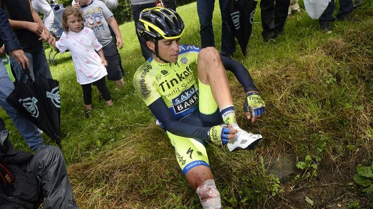 Spain's Alberto Contador sits after a fall during the 161.50 km tenth stage of the 101st edition of the Tour de France