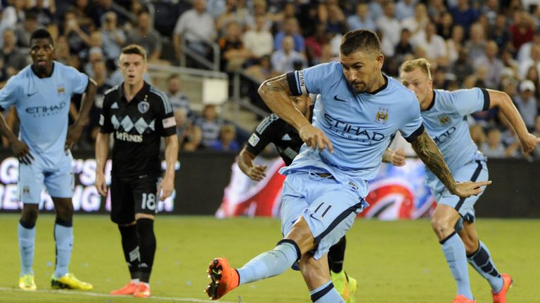Manchester City FC defender Dedryck Boyata scores on a penalty shot against Sporting Kansas City during 