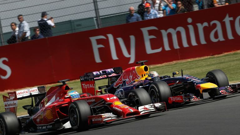 Fernando Alonso and Sebastian Vettel fight it out at Silverstone