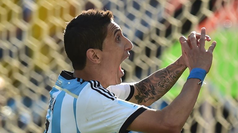 Di Maria wheels away after firing Argentina into the quarter-finals of the World Cup