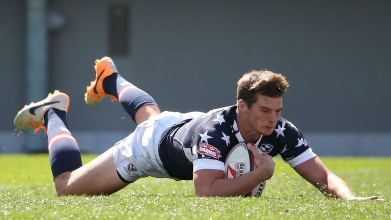 Brett Thompson of USA dives to score a try against Samoa during the Tokyo Sevens, the six round of the HSBC Sevens World Series