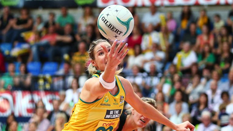 CANBERRA, AUSTRALIA - OCTOBER 13:  Caitlin Bassett of Australia reaches for possession during game five of the Constellation Cup series between the Austral