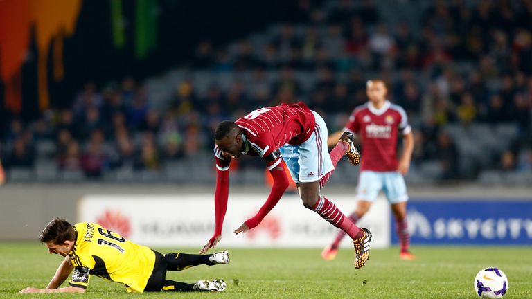 Cheikhou Kouyate of West Ham trips over Louis Fenton of Wellington Phoenix during the Football United New Zealand Tour friendly match