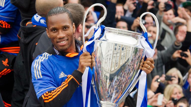 Chelsea striker Didier Drogba holds the Champions League 