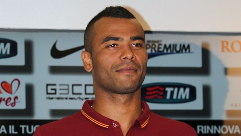 ROME, ITALY - JULY 15:  New signing Ashley Cole poses for photographs holding a AS Roma Shirt during the press conference at the AS Roma Training Centre on