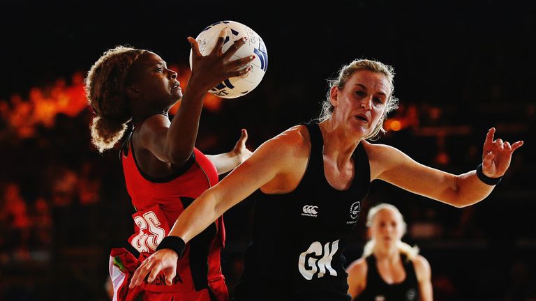 GLASGOW, SCOTLAND - JULY 25:  Mwai Kumwenda of Malawi competes with Leana De Bruin of New Zealand for the ball during the Pool A netball match between New 