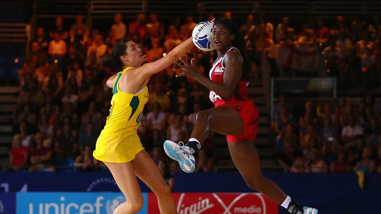 Sasha Corbin of England leaps for the ball in front of Sharni Layton of Australia