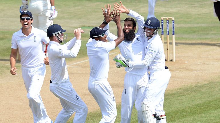 England's Moeen Ali is congratulated by his team mates after taking the wicket of India's Bhuvneshwar Kumarduring day five of the Third Test